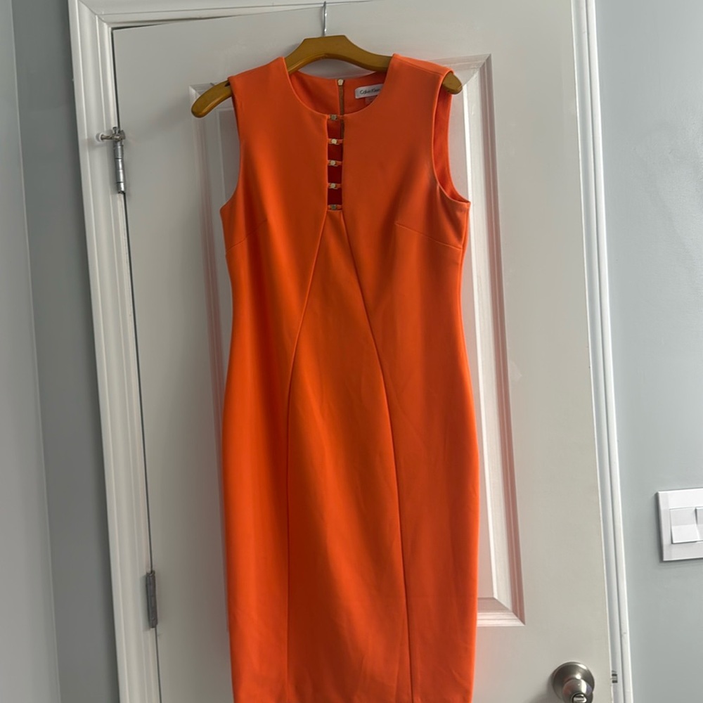 Orange Calvin Klein dress with gold accents